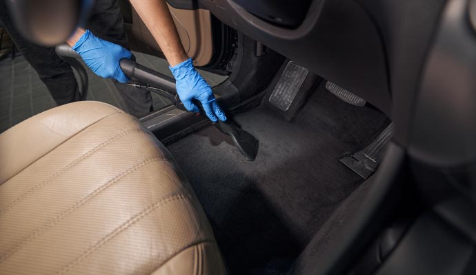 Professional worker cleaning car interior Professional worker cleaning car interior