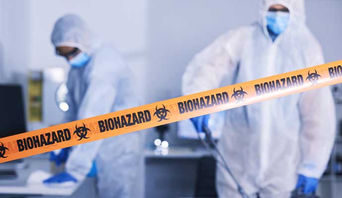 Professionals cleaning up a biohazard scene