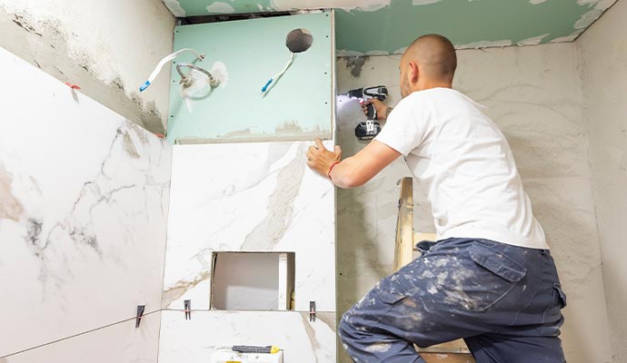 professional worker remodeling a bathroom