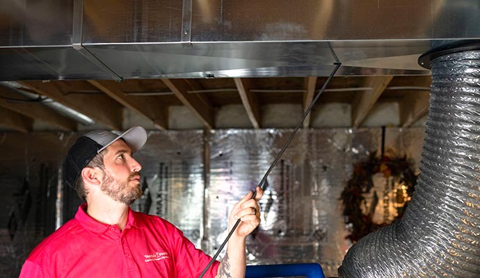 Professional worker cleaning ducts Professional worker cleaning ducts