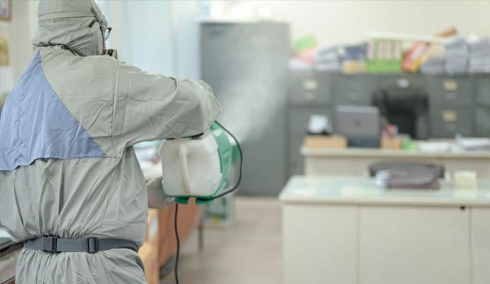 Professional disinfecting a commercial office space Professional disinfecting a commercial office space