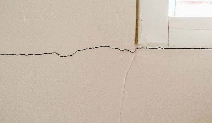 Wall crack near window Wall crack near window